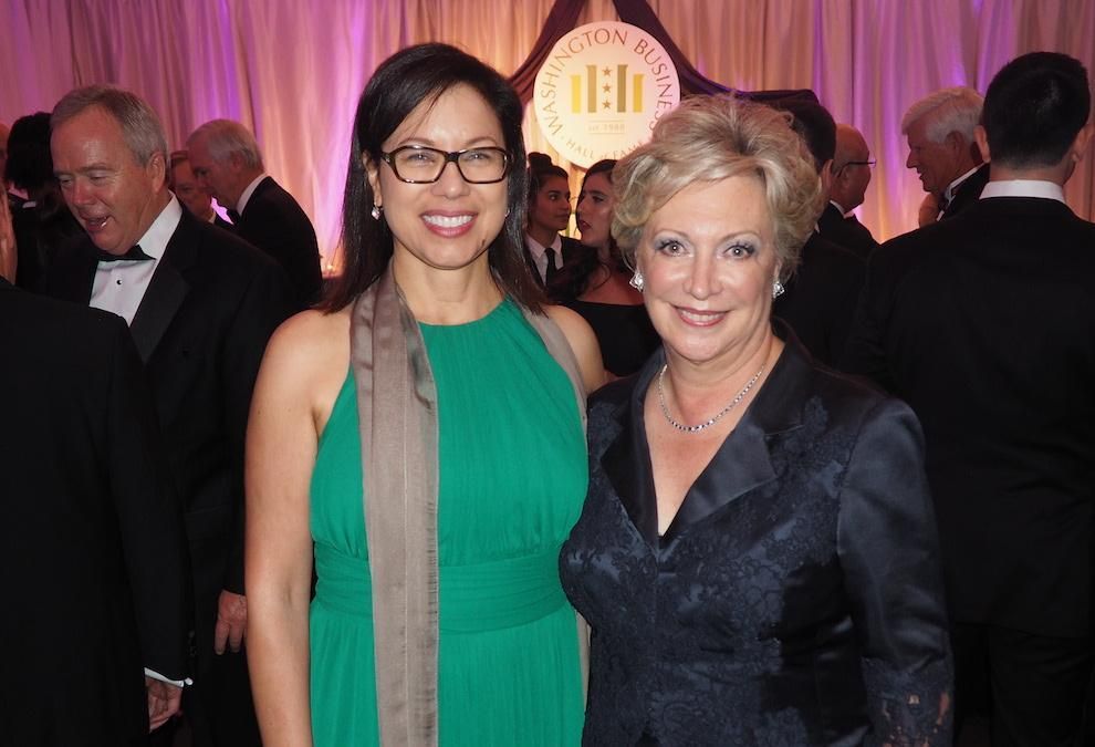 Two women standing and smiling together for a photo